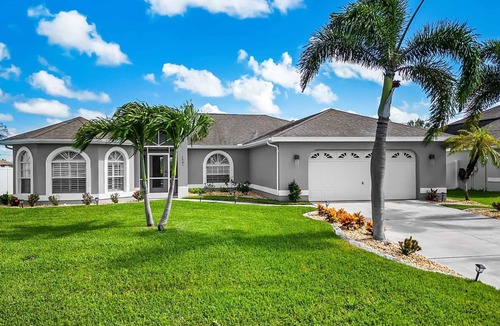 Mariner House | Tropical Gem! Sparkling Saltwater Pool Peaceful Canal with Dock Luxe Comfort