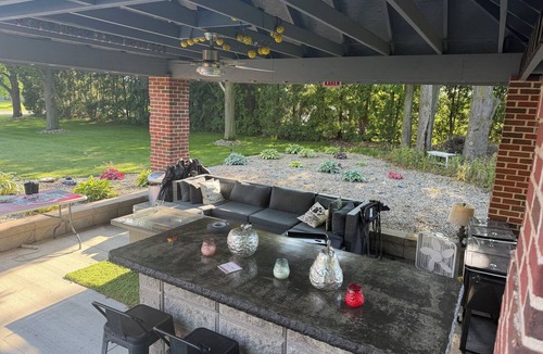 Galion House | Unique RV getaway with a private pickleball court, swim spa and shaded pavilion.