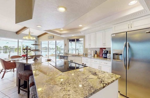 Eight Lakes House | Villa Aasta | Luxe Lakefront Outdoor Living | Screened Pool, Game Room & Dock