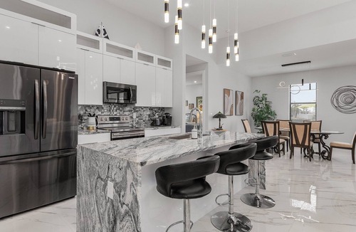Del Tura Villa | Villa Del Sol Vacation HEATED Pool home with outdoor TV and work, office room.