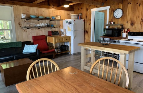 Winthrop Cabin | Walk out beach in private cove on Cobboossee Lake