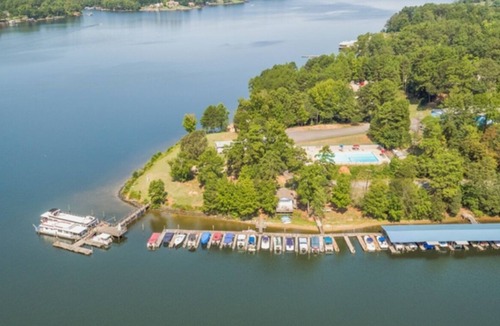 Steele Creek Cabin | Waterfront, 100- Year-Old wood Cabin #16 at Long Cove Resort by RedAwning