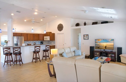 Cape Coral Villa | Waterfront home with oversized heated pool & spa, bikes, beach gear!