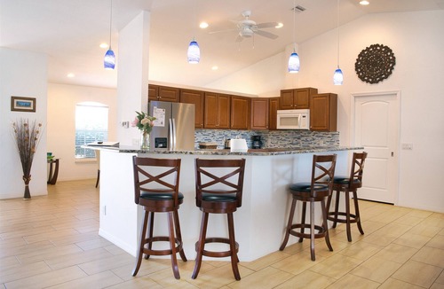 Cape Coral Villa | Waterfront home with oversized heated pool & spa, bikes, beach gear!