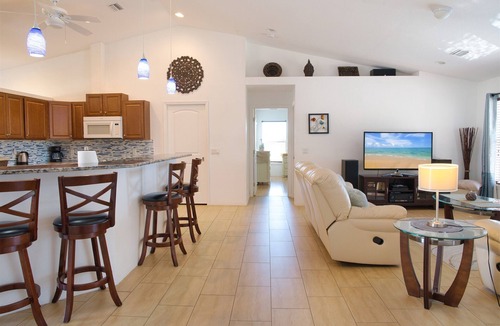 Cape Coral Villa | Waterfront home with oversized heated pool & spa, bikes, beach gear!