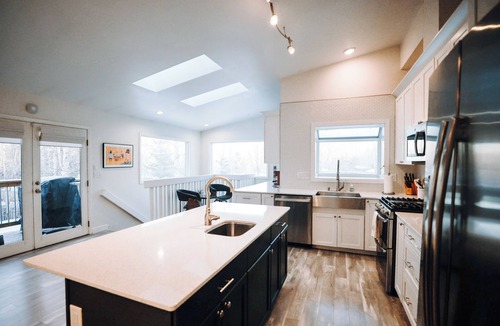 Tudor Area House | Wild About Anchorage · Hot Tub · Rooftop Patio · Chef's Kitchen · Coffee Bar