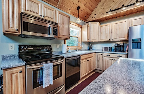 South Pond Shores Ski Chalet | Woodroad Chalet- Ski house close to water, Hot tub, large lot