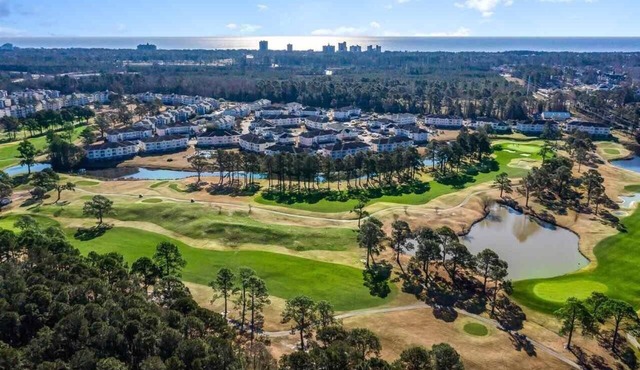 1st Floor Unit W/Patio, Golf Course and Pool View, less than 10 Min to the Beach