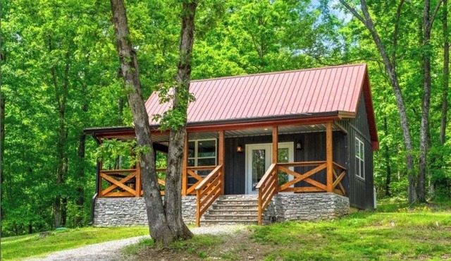 Cozy 2-bedroom cabin nestled in the woods adjoining Pennyrile Forest State Park.
