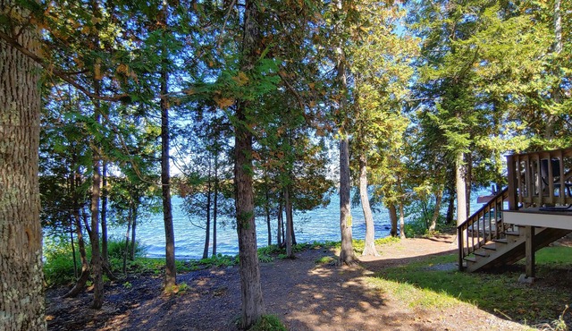 Cozy lakefront home w/ a firepit, outdoor shower, & private beach!