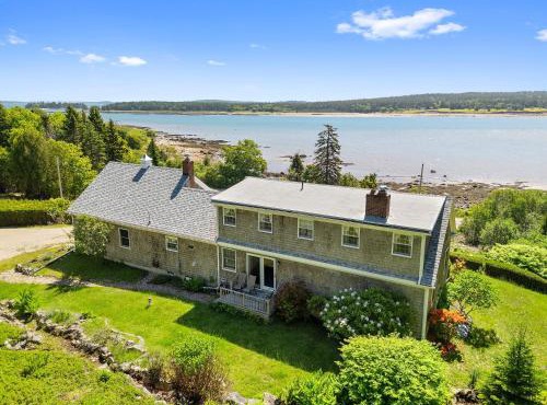 Dog-friendly oceanfront home with private shorefront, two fireplaces, & firepit