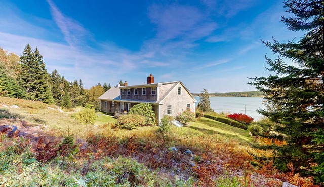 Dog-friendly oceanfront home with private shorefront, two fireplaces, & firepit