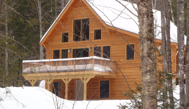 Elegant custom chalet in private wooded location close to skiing, golf, village