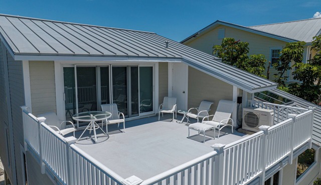 Experience luxury at H-821 Belcher, a spacious 4-bedroom home in Boca Grande!