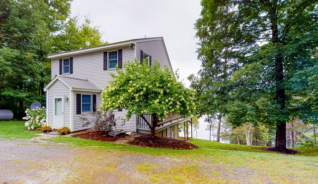 Lakefront home with private dock, deck, grill, & great view