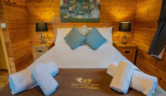 Large three bedroom log cabin with private hot tub and decking over looking the beautiful river Brue in East Huntspill