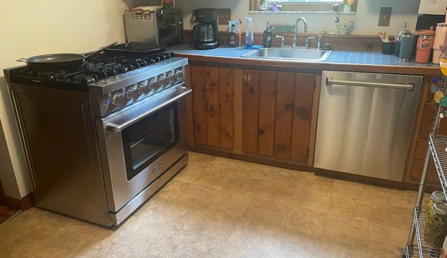 Private home with great location and amenities! Wraparound deck in the woods!