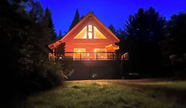 Ride right from this trailside cozy cabin in the woods with private pond.