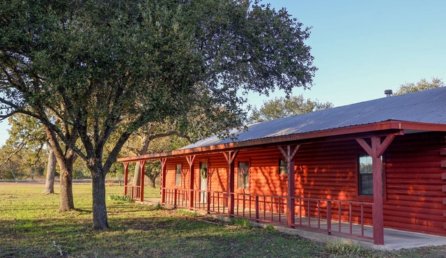 Rustic Log Cabin Near Texas A&M – Spacious Retreat with Pond & Firepit!
