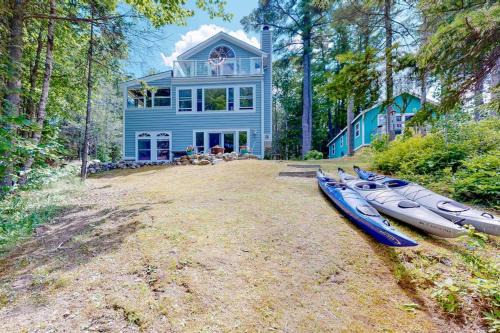 Secluded waterfront home with firepit, gas grill, kayaks, dock, balcony, & patio