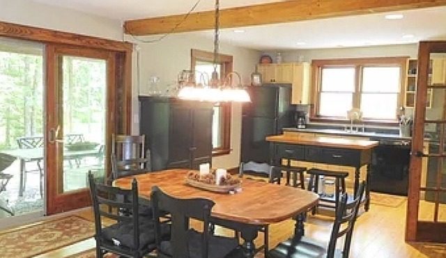 Spacious river home w/pellet stove, outdoor dining area, fire pit, & BBQ grill