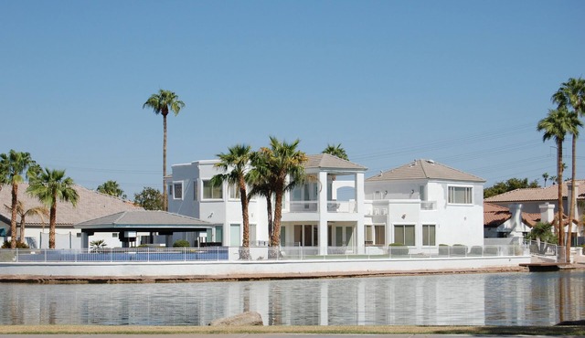 This GORGEOUS custom home is located on 3/4 acre waterfront in Gilbert Arizona