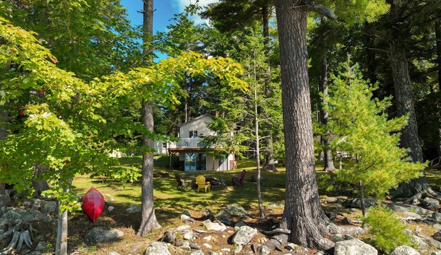 Two-story lakefront home with a seasonal dock, furnished deck, & washer/dryer