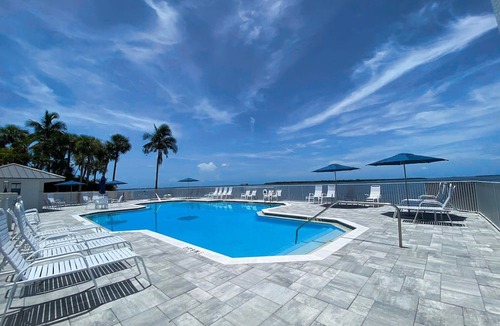Punta Rassa Condo | Sanibel Harbour Resort Bay View Tower 535: Beachfront vacation retreat with stunning sunset views.